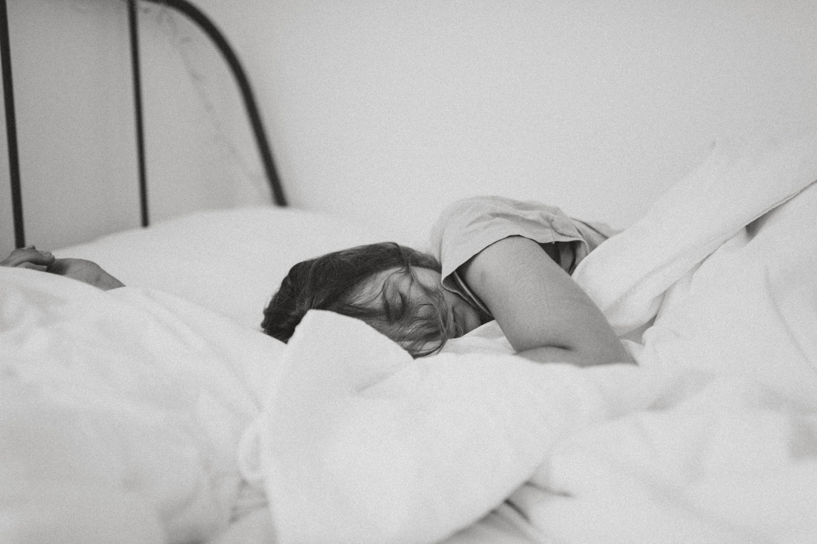 sleeping woman lying on bed